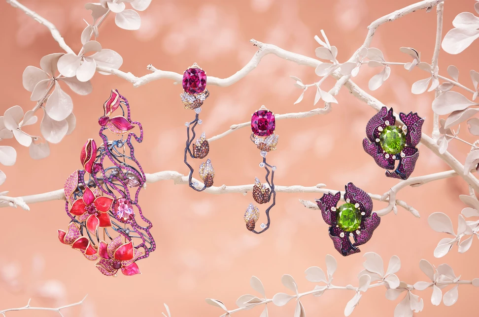 <p>IDORO creations including the Sakura – Wind in the Garden brooch in blackened 18k rose gold set with a 4.31 carat pink spinel, round and pear-shaped Burmese rubies, ruby pavé, pink sapphires, morganite and diamonds, the Magnolia earrings with rhodolite garnets and diamonds in black-rhodium plated 18k gold, and the Peony earrings with chrysolites, rubies, and diamonds in black rhodium-plated 18k yellow gold</p>
