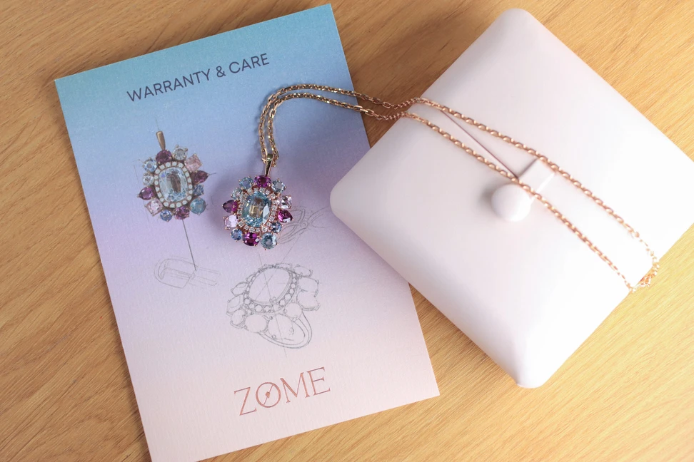 <p>Zome Jewellery Aquamara necklace from the Oceanis collection with an 8 carat aquamarine, 2.35 carats of Malay garnets, 1.7 carats of pink sapphires and diamonds set in 18k rose gold </p>