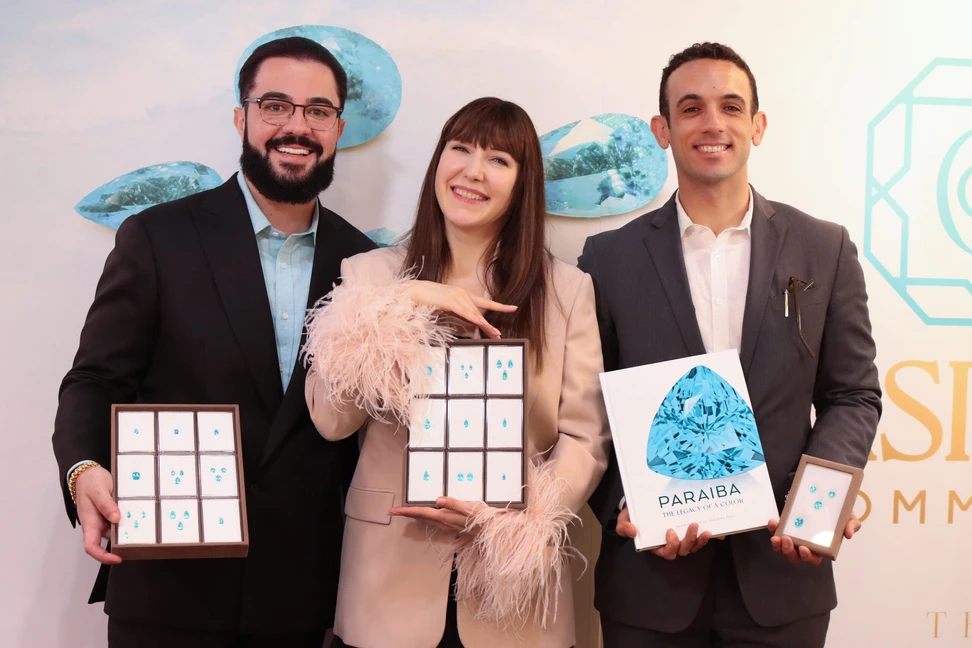 <p>Brasil Gem Commerce CEO Victor Lima (left) with Katerina Perez and US-based Paraiba tourmaline dealer Kevin Ferreira</p>