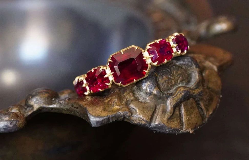 <p>Jogani Victorian style ring with five unheated ‘pigeon’s blood’ Burmese rubies of 3.10 carats total, set in 18k gold</p>