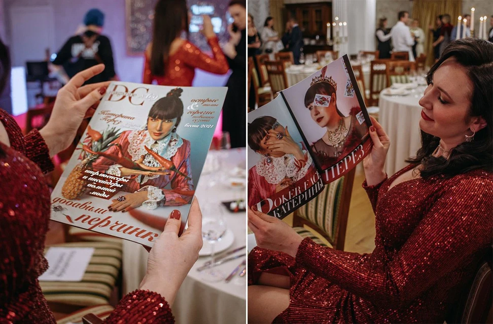 <p>Katerina Perez holds up an issue of DC Magazine that features her photograph on the cover at the DC Awards in St Petersburg</p>