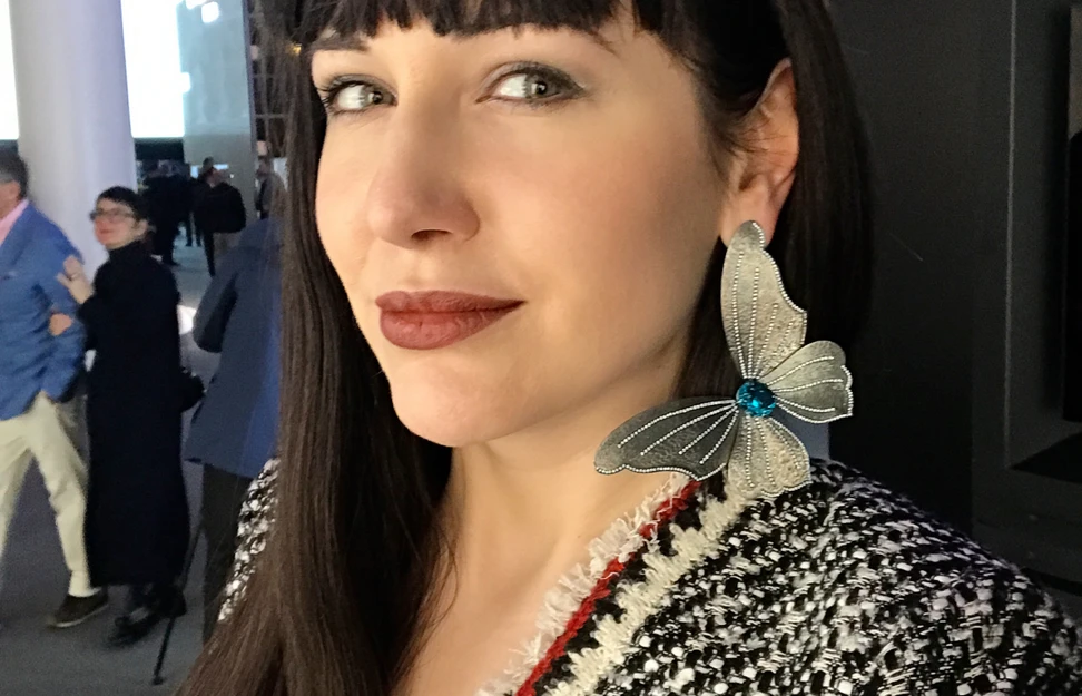 <p>Katerina Perez tries the solo butterfly earring with blue zircon and diamonds in titanium for the first time at Baselworld</p>