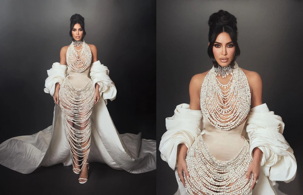 <p>Kim Kardashian attended the 2023 MET Gala wearing a Schiaparelli ensemble featuring 50,000 draped freshwater pearls, plus a choker, pearl drop earrings and a ring by Lorraine Schwartz</p>