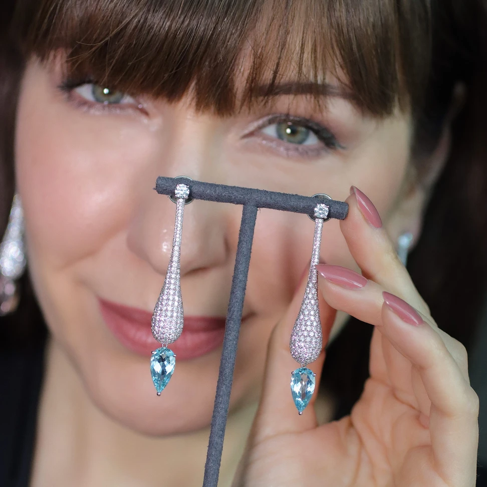 <p><span class="TextRun SCXP231295650 BCX0" lang="EN-US" xml:lang="EN-US" data-scheme-color="@000000,," data-usefontface="true" data-contrast="none"><span class="NormalTextRun SCXP231295650 BCX0">Drops of Grace earrings, handcrafted in </span></span><span class="TextRun MacChromeBold SCXP231295650 BCX0" lang="EN-US" xml:lang="EN-US" data-scheme-color="@000000,," data-usefontface="true" data-contrast="none"><span class="NormalTextRun SCXP231295650 BCX0">18k white gold with pavé set natural </span></span><span class="TextRun MacChromeBold SCXP231295650 BCX0" lang="EN-US" xml:lang="EN-US" data-scheme-color="@000000,," data-usefontface="true" data-contrast="none"><span class="NormalTextRun SCXP231295650 BCX0">diamonds </span></span><span class="TextRun SCXP231295650 BCX0" lang="EN-US" xml:lang="EN-US" data-scheme-color="@000000,," data-usefontface="true" data-contrast="none"><span class="NormalTextRun SCXP231295650 BCX0">totalling </span></span><span class="TextRun MacChromeBold SCXP231295650 BCX0" lang="EN-US" xml:lang="EN-US" data-scheme-color="@000000,," data-usefontface="true" data-contrast="none"><span class="NormalTextRun SCXP231295650 BCX0">8-9 carats and pear shape</span></span><span class="TextRun MacChromeBold SCXP231295650 BCX0" lang="EN-US" xml:lang="EN-US" data-scheme-color="@000000,," data-usefontface="true" data-contrast="none"><span class="NormalTextRun SCXP231295650 BCX0"> aquamarines </span></span><span class="TextRun SCXP231295650 BCX0" lang="EN-US" xml:lang="EN-US" data-scheme-color="@000000,," data-usefontface="true" data-contrast="none"><span class="NormalTextRun SCXP231295650 BCX0">of around </span></span><span class="TextRun MacChromeBold SCXP231295650 BCX0" lang="EN-US" xml:lang="EN-US" data-scheme-color="@000000,," data-usefontface="true" data-contrast="none"><span class="NormalTextRun SCXP231295650 BCX0">5-6 carats</span></span><span class="TextRun SCXP231295650 BCX0" lang="EN-US" xml:lang="EN-US" data-scheme-color="@000000,," data-usefontface="true" data-contrast="none"><span class="NormalTextRun SCXP231295650 BCX0">​</span></span></p>
