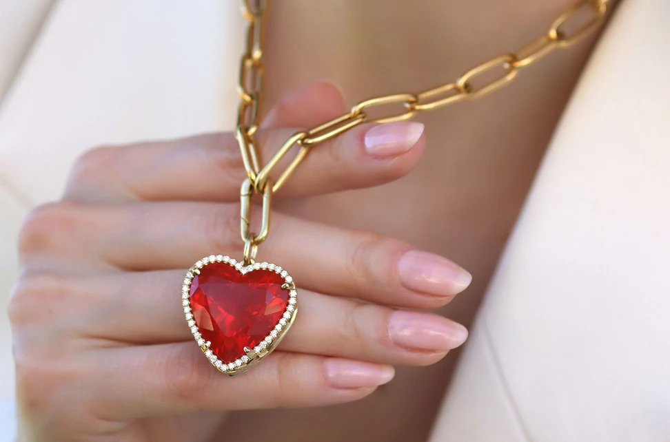 <p>Lisa Nik Heart pendant from the Colors collection, set with a 24.88 carat fire opal and diamond accents in 18k yellow gold</p>
