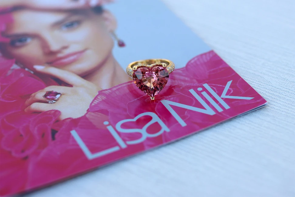 <p>A ring from the Lisa Nik Colors collection, set with an 11.41 carat Malaya garnet and diamonds in 18k yellow gold</p>
