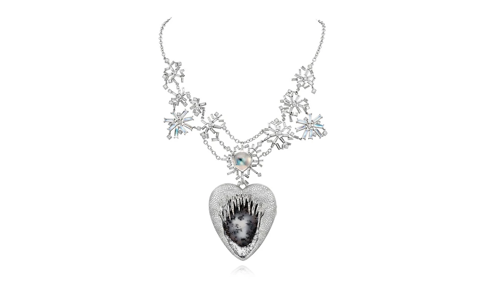 <p>The White Paradise high jewellery pendant. The heart drips with diamond icicles, cracking open under the weight of the cold to reveal a dendritic opal</p>
