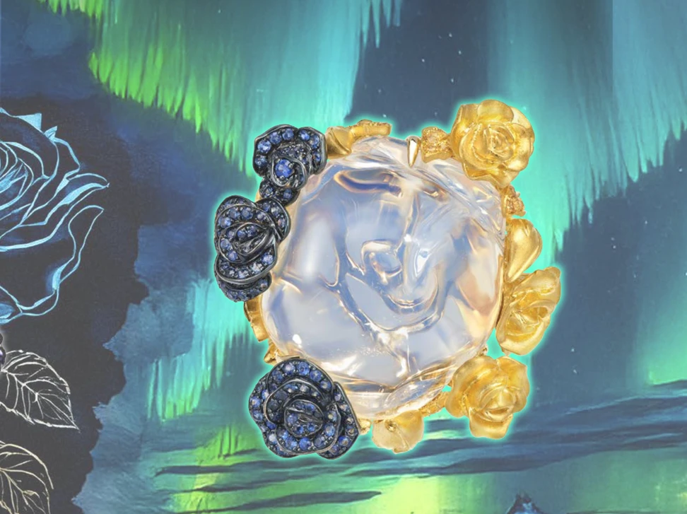 <p>The Singing Winter high jewellery ring. The ring’s central opal is shaped like the petals of a rose, framed by clusters of flowers in blackened gold set with sapphires and 18k yellow gold</p>
