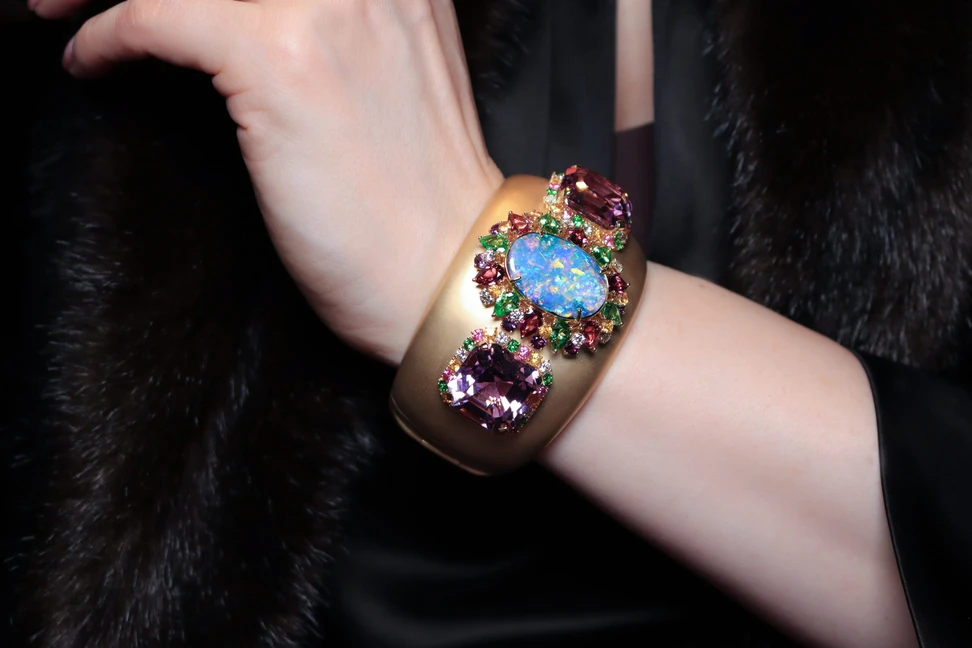 <p>Margot McKinney Palm Beach cuff with a 21.10 carat Australian boulder opal, 53.75 carats of kunzites, diamonds, yellow sapphires, pink sapphires, tsavorites, amethysts and pink tourmalines, set in 18k yellow gold</p>
