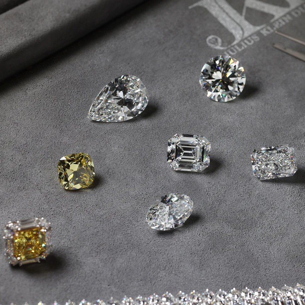 <p>Loose 10-15 carat diamonds and a superb pair of matching Vivid Yellow square emerald cut diamond earrings</p>
