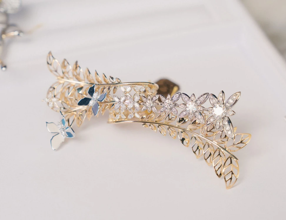 Hidden Nature by Yasunori Konishi of Michael Hill Jewellers, a two-tone gold and diamond ring featuring flowers, butterflies and openwork leaves, winner of the Red Carpet category and the Supreme Award