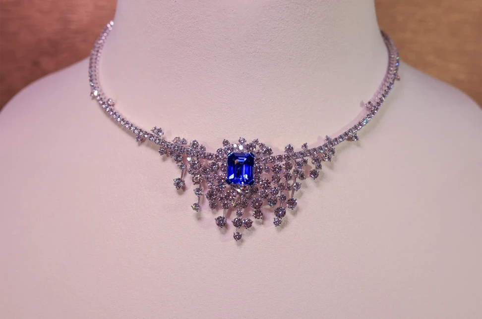 A second Moonlight Reflection necklace, set with an emerald-cut tanzanite and diamonds
