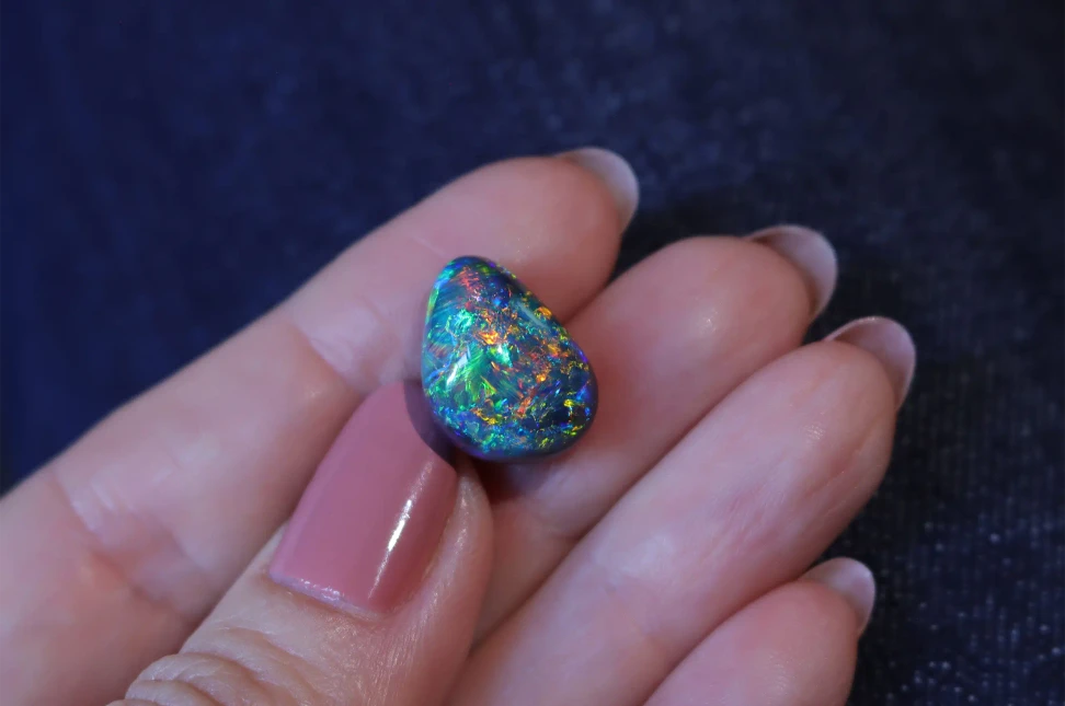 A 9.55-carat Australian black opal from Olivia Chan’s collection, combining vivid colour with the unusual patterning Olivia is drawn to