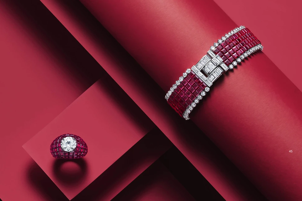 <p>Deep technical skill is required to create Oscar Heyman&#8217;s signature invisible set styles. Stones are individually cut and arranged without visible metal. The result is a seamless mosaic with sculptural and dimensional appeal. Here, a flexible bracelet pairs with a magnificent ring. The ring alone features 88 square rubies, each individually cut for its unique home surrounding a 4ct F/VS2 round diamond</p>
