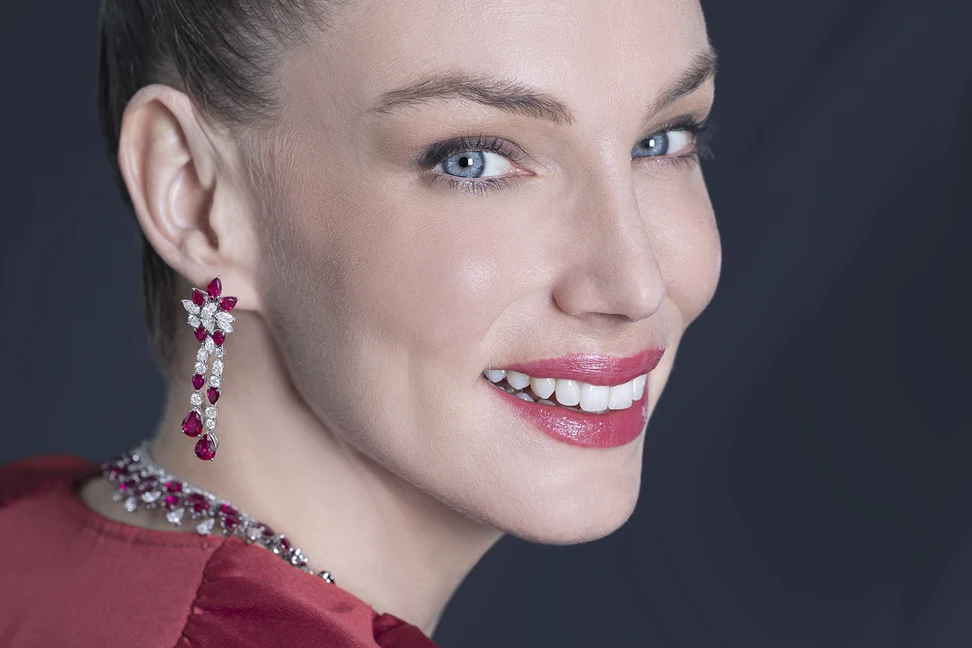 <p>A model wears the Picchiotti Burma Super Star set from the Picchiotti Classics collection, including a pair of earrings with 2.01 carats of pear-shaped Burmese rubies, further Burnese rubies of nearly 14 carats, and pear-shaped, marquise-shaped and round brilliant-cut diamonds totalling 6.54 carats, all set in 18k white gold </p>
