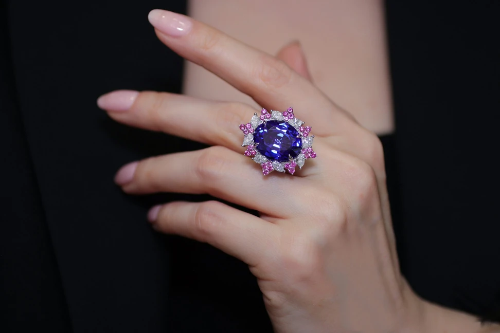 <p>Katerina Perez wears the Imperial Bloom ring, part of the Imperial Bloom suite, with an oval-shaped tanzanite, diamonds and pink sapphires by Palm Beach Gems by Nicole</p>