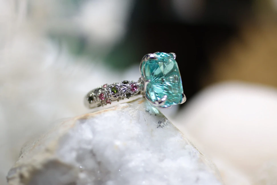 <p>Palm Beach Gems by Nicole Lagoon Flower Garden ring, designed by Robin Callahan, set with a 14.70 carat lagoon tourmaline and further green and pink tourmalines in 14k white gold</p>