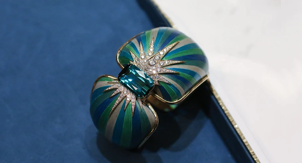 <p>Piaget ‘Sunlight Escape’ collection ‘Green Aurora’ manchette with 14.53 ct cushion-cut tourmaline and diamonds with wood marquetry in 18K pink gold</p>