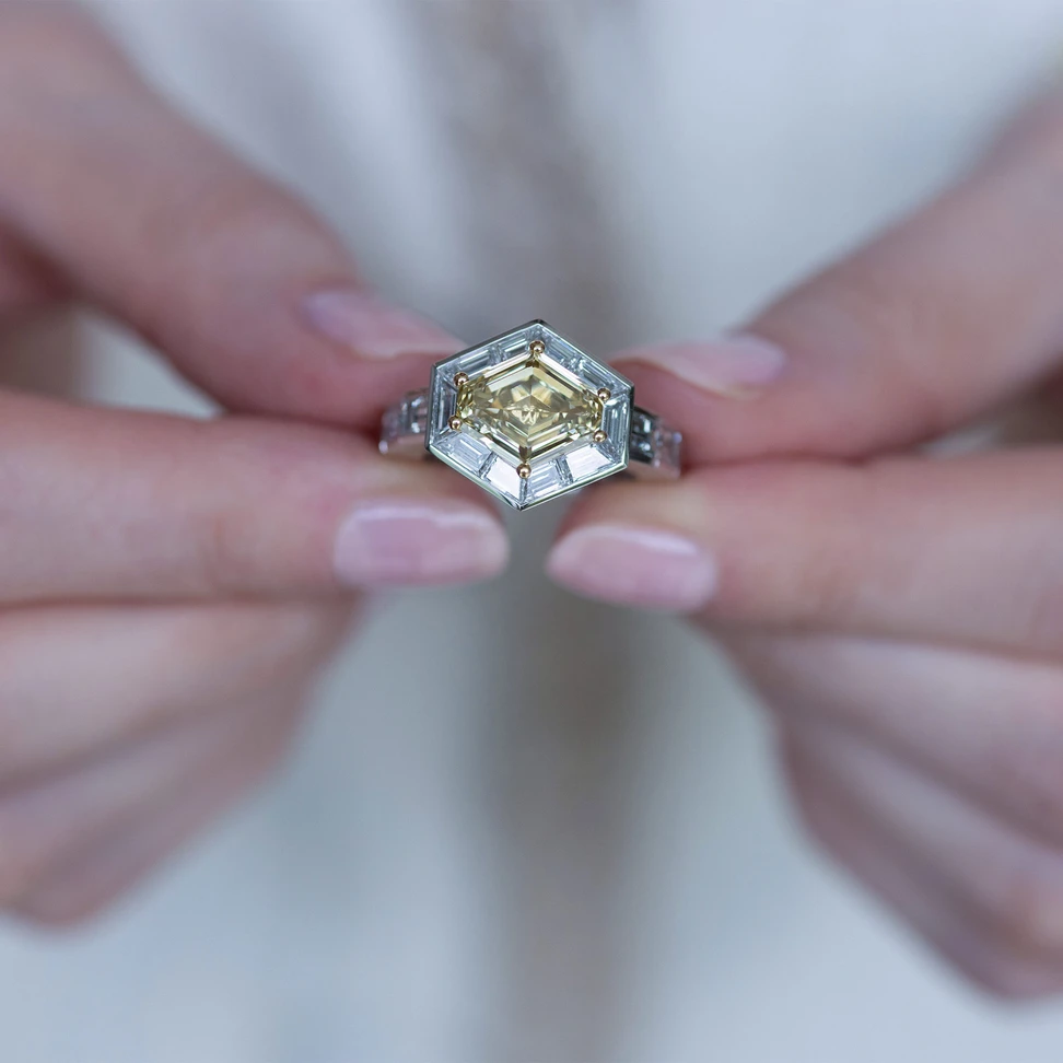<p>A new ring from the Hexagon Trilogy, set with a 3.01ct hexagonal Fancy Brownish Yellow diamond and baguette-cut white diamonds</p>
