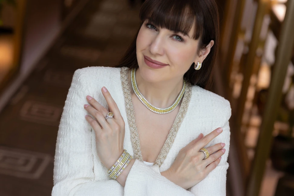 <p>Katerina wears Picchiotti’s new “Warming Trend” Xpandable designs, where radiant-cut Fancy Yellow diamonds are set between crisp white stones</p>
