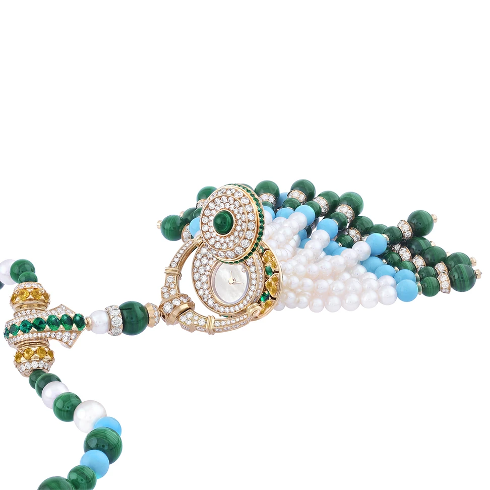 <p>Van Cleef & Arpels Pompon Gaia transformable long necklace watch in yellow gold with yellow sapphires, emeralds, malachite, turquoise, pearls, mother-of-pearl, diamonds and a quartz movement</p>