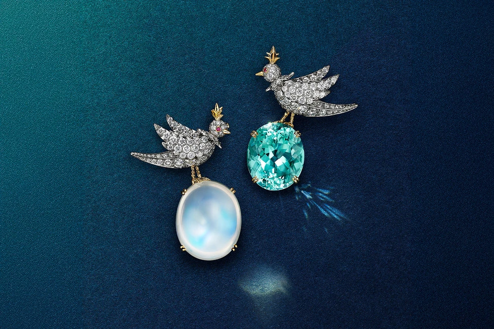 <p>Tiffany &amp; Co. Bird on a Rock: Love Birds high jewellery brooches in platinum and 18k yellow gold, set with an an oval cabochon moonstone of 45.04 carats and an oval blue cuprian elbaite tourmaline of 21.13 carats</p>
