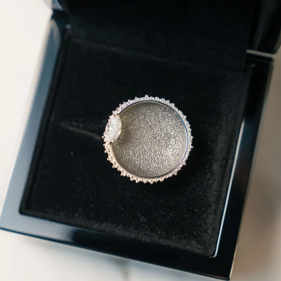 Eclipsis Solis ring by Travis Trewarne of Trewarne Fine Jewellery, inspired by a solar eclipse, with a concave centre and marquise-cut diamond representing the final flash of sunlight