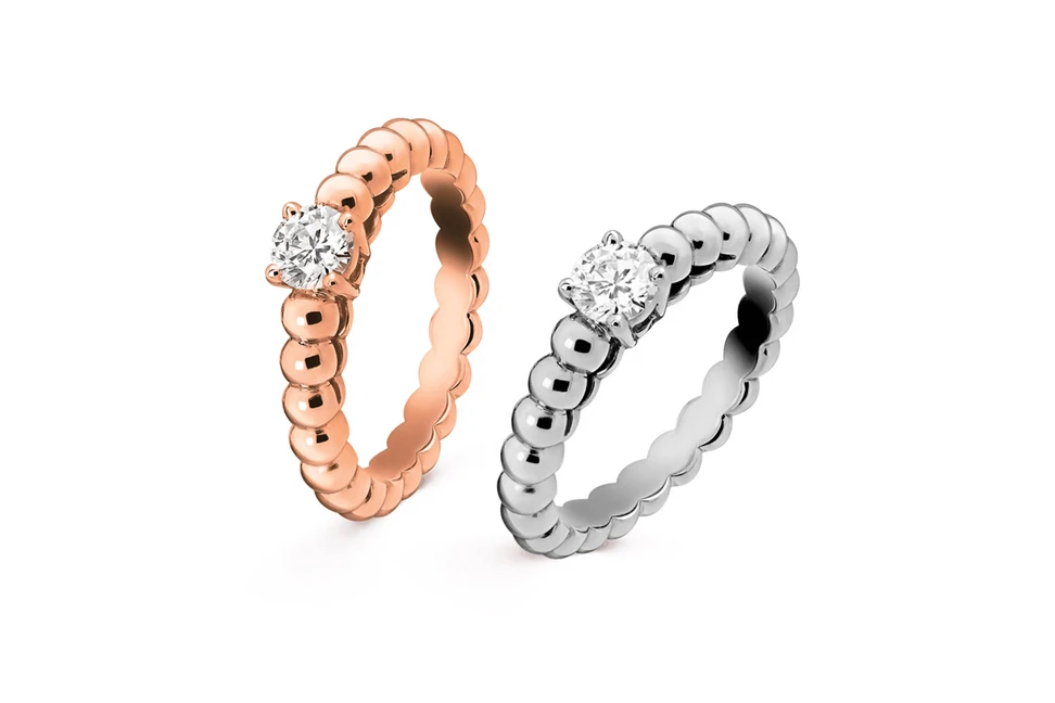 <p>Van Cleef & Arpels ‘Perlée solitaire’ rose gold and white gold diamond engagement rings</p>
