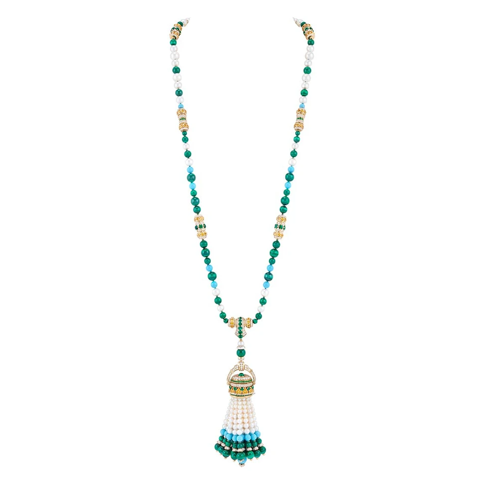 <p>Van Cleef & Arpels Pompon Gaia transformable long necklace watch in yellow gold with yellow sapphires, emeralds, malachite, turquoise, pearls, mother-of-pearl, diamonds and a quartz movement</p>