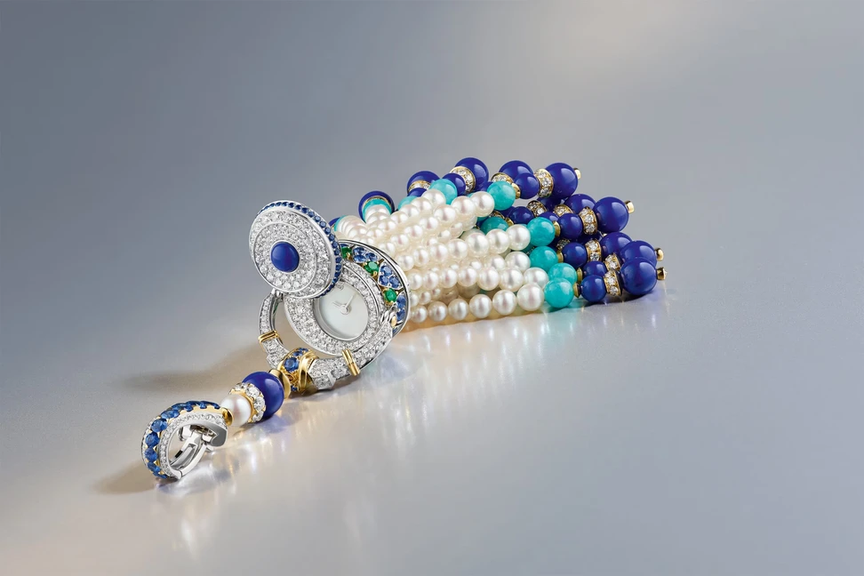 <p>Van Cleef & Arpels Pompon Gaia transformable long necklace watch with detachable clip</p>