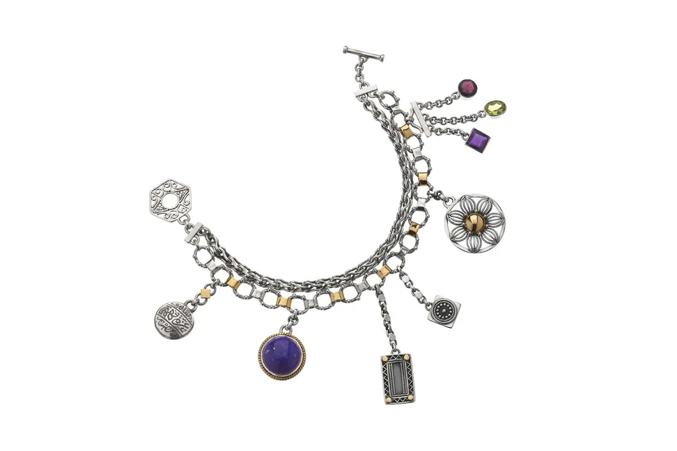 <p>Silver/Gold Charm Bracelet, Silver and gold double-layered T-lock bracelet adorned with multiple charms embellished with hand-pierced filigree, geometric and floral-inspired motifs, and a beautiful assortment of colorful stones</p>