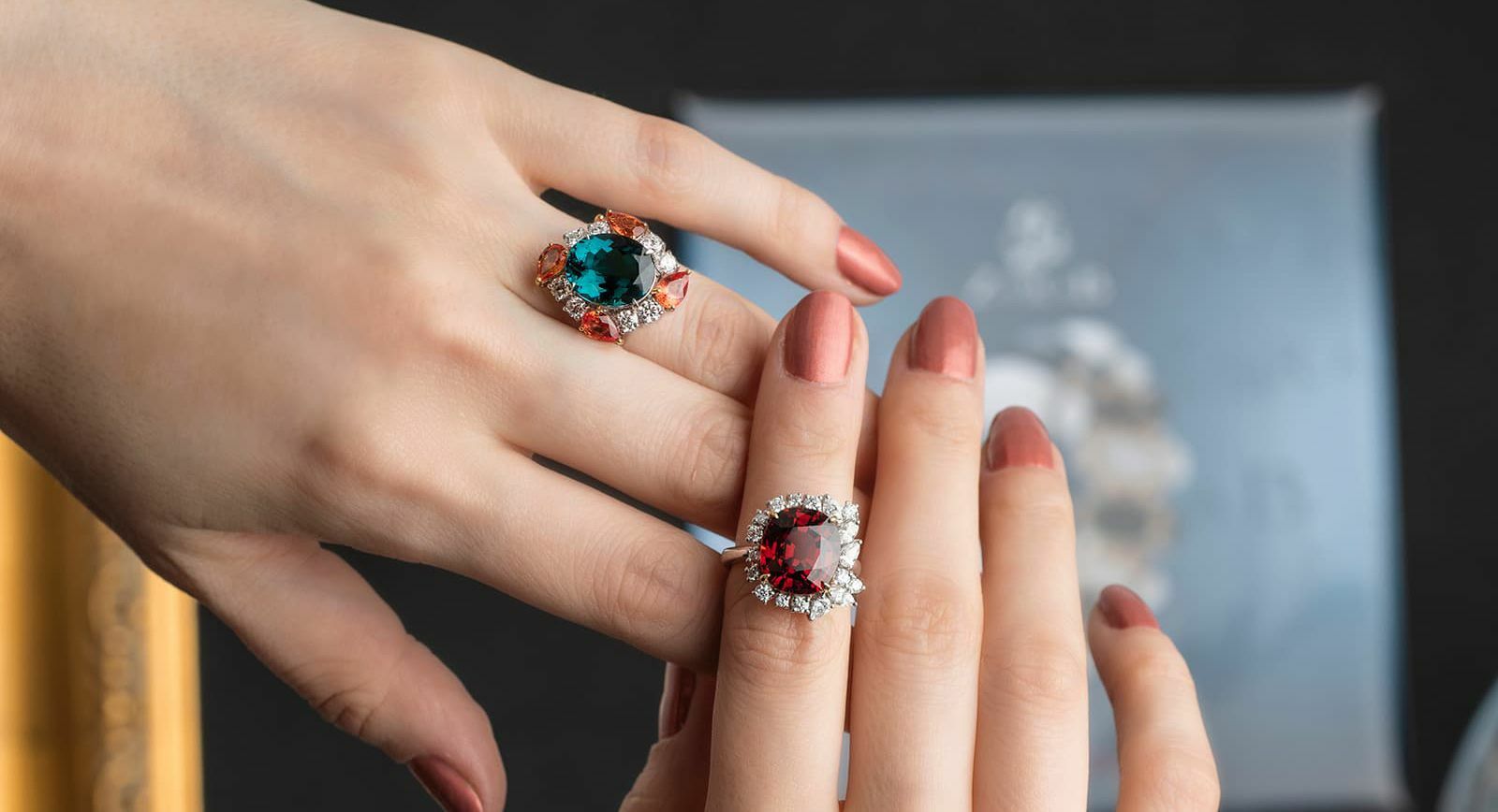 Jessie Foo Yuli Jewellery blue tourmaline ring with padparadscha sapphires and diamonds and spessartite garnet ring with diamonds