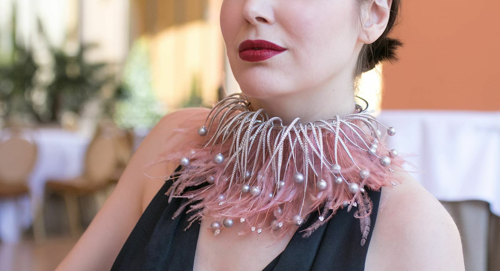 Katerina Perez wears the Flamingo Choker with feathers, diamonds and pearls by Mike Saatji of Mike Joseph Jewellery