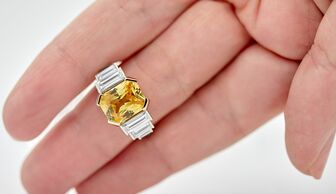 S1x1 taylor   hart diamond ring  bespoke er with a 6.60 ct radiant yellow sapphire and straight diamond baguettes