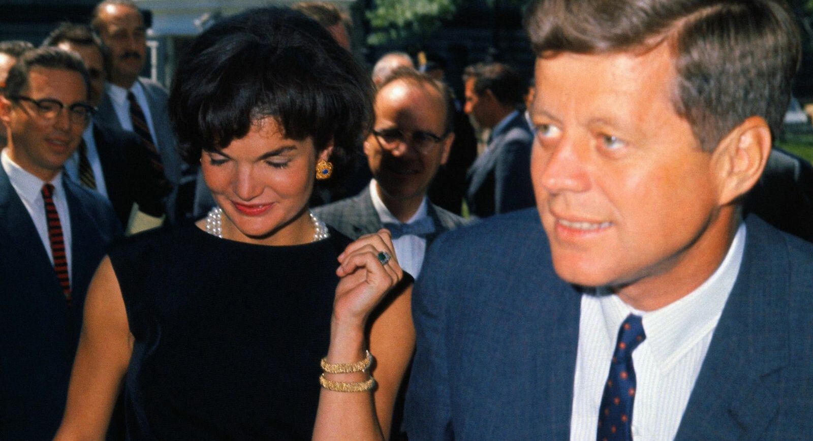 Jackie Kennedy wearing her famous emerald and diamond engagement ring by Van Cleef & Arpels 