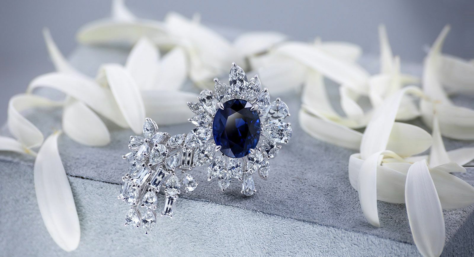 QIU Fine Jewelry ring with an 8.08 carat unheated Burmese Royal Blue sapphire and 8 carats of diamonds