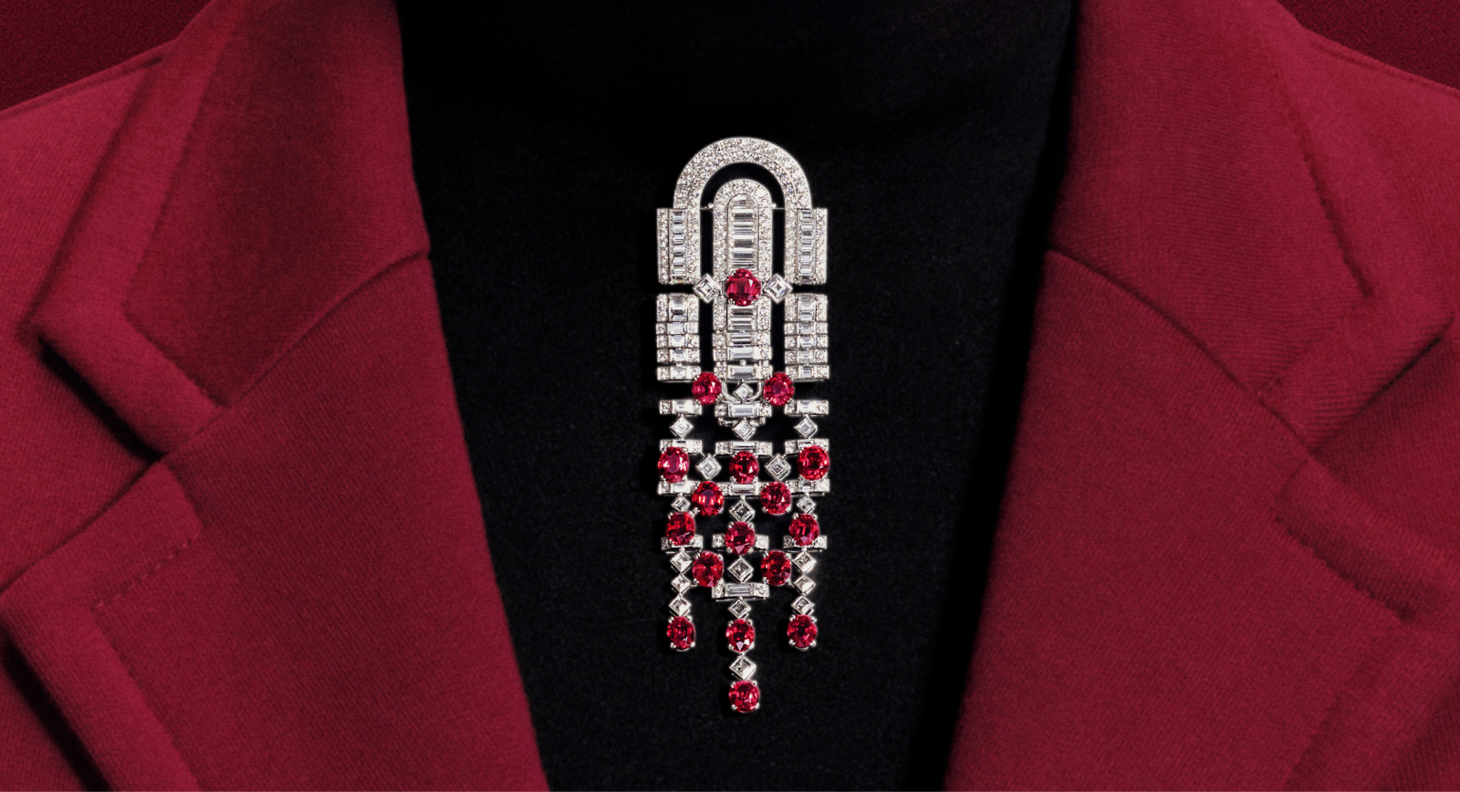 Rolling Red brooch with 17 oval rubies from Mozambique for a total weight of 18.82 carats, paved with diamonds in 18k white gold from the Boucheron Like a Queen High Jewellery Collection