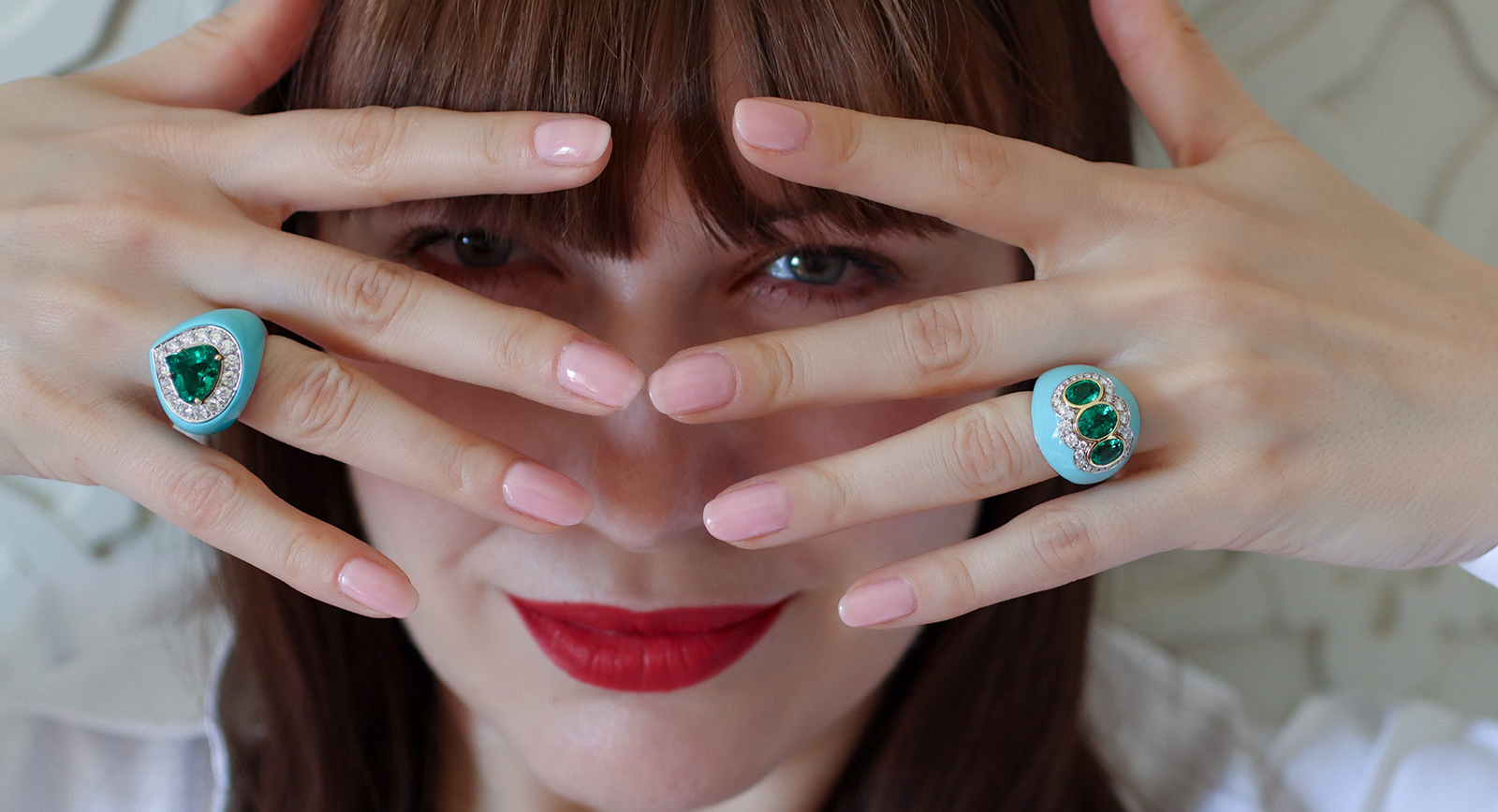Katerina Perez wears turquoise, emerald and diamond rings by Veschetti 