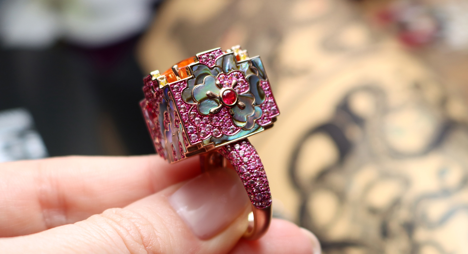 Austy Lee ‘The Night of Floréal’ ring from The Sanctus-cubes collection in 18K rose gold with Fanta spessartite garnet, Mozambican unheated rubies, abalone shell and fancy colour diamonds
