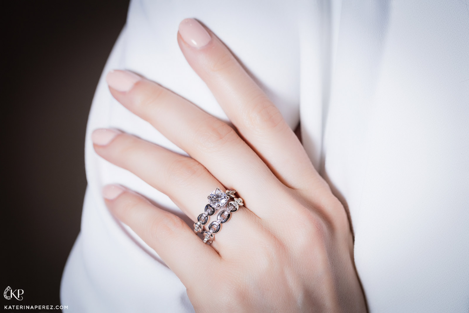 Scott Kay Embrace collection engagement ring and wedding band. Photo by Simon Martner.