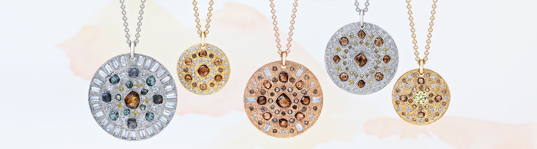 De Beers Talisman collection pendants with rough diamonds