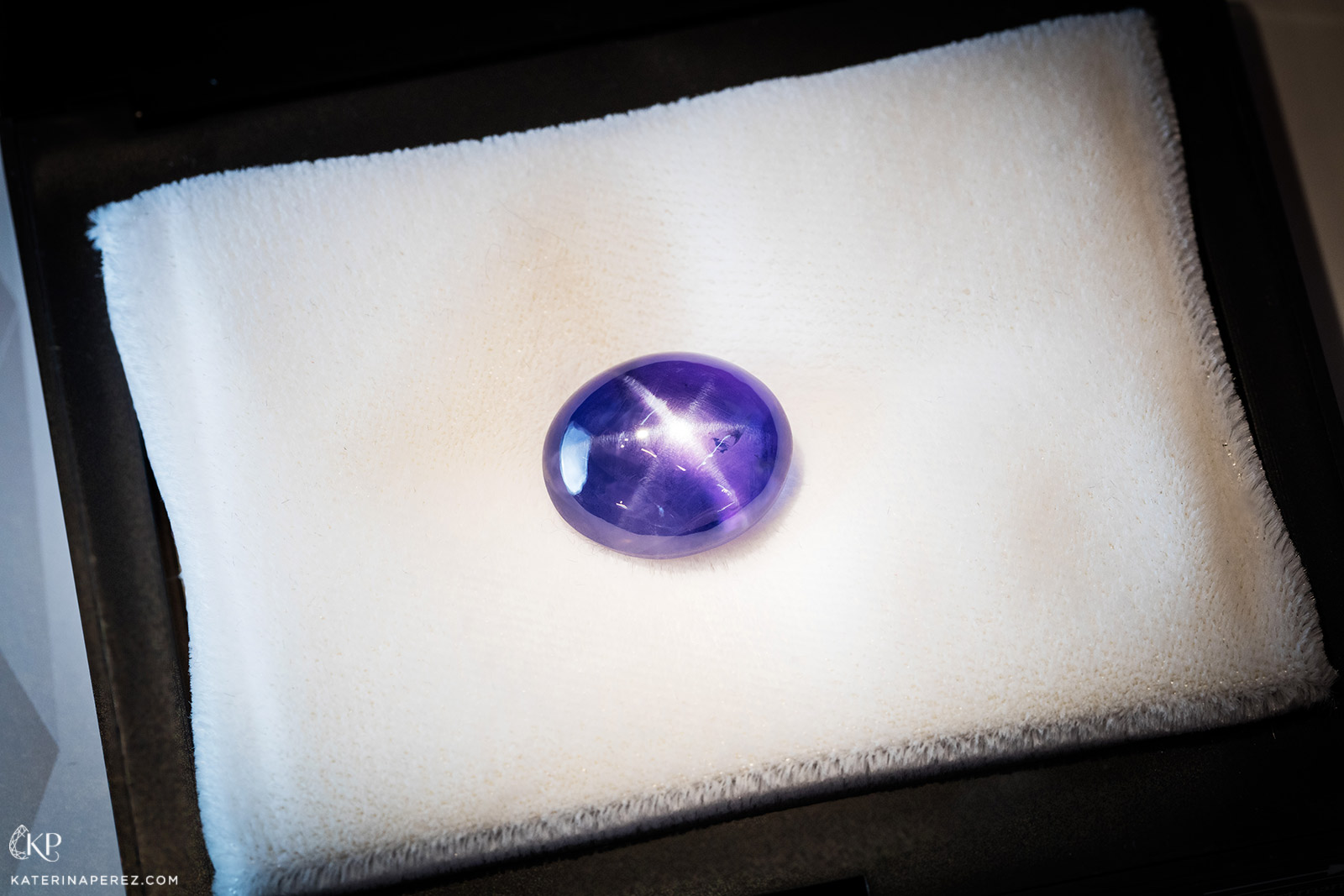 Constantin Wild cabochon cut 29 carat fancy purple star sapphire. Photo by Simon Martner