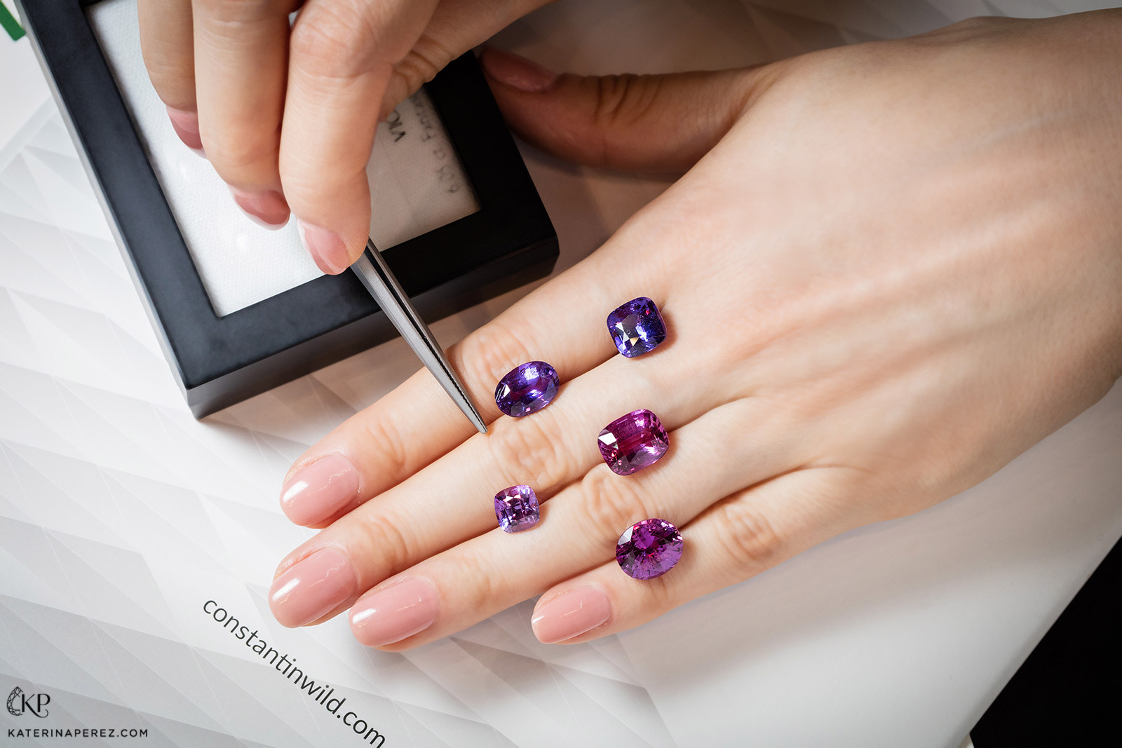 A selection of fancy coloured purple hue sapphires in a variety of cuts from Constantin Wild. Photo by Simon Martner