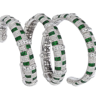 A stunning Avakian flexible cuff bracelet set with emeralds and diamonds
