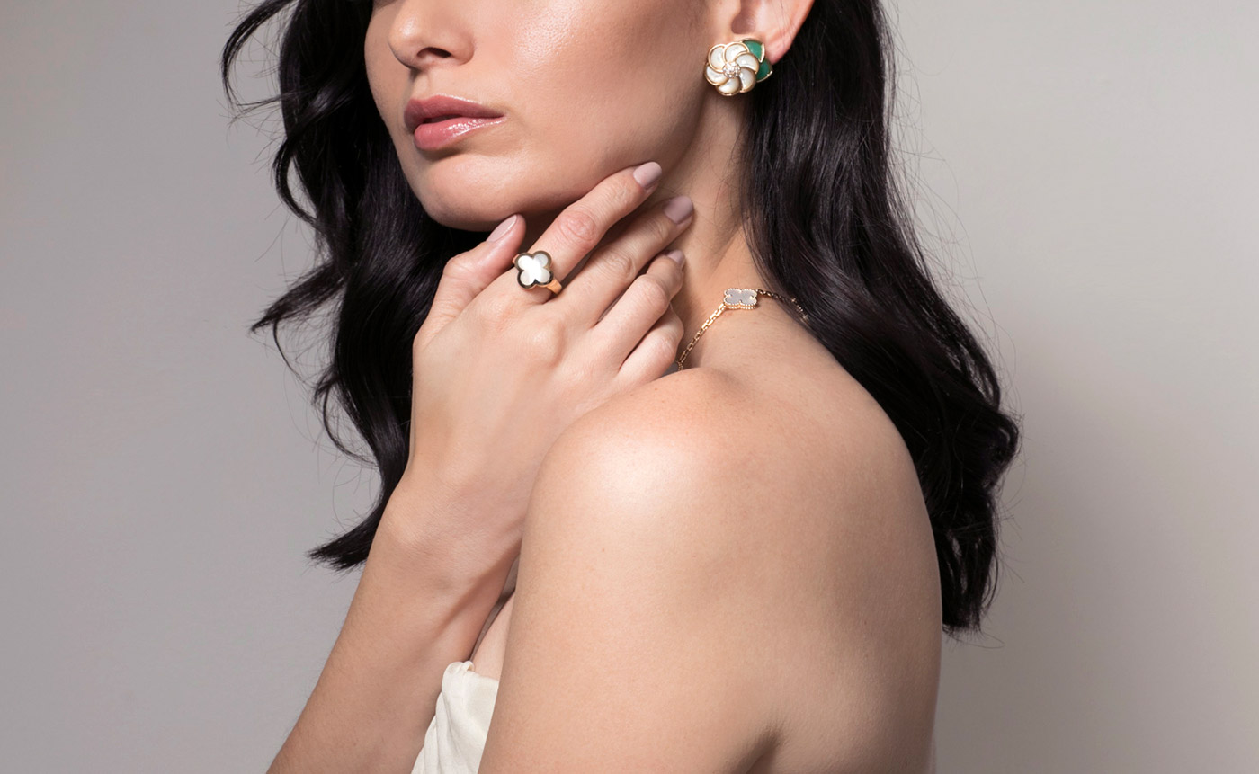 Van Cleef&Arpels 'Alhambra' necklace, earrings and ring from Court&Covet in mother-of-pearl, chalcedony and 18k yellow gold