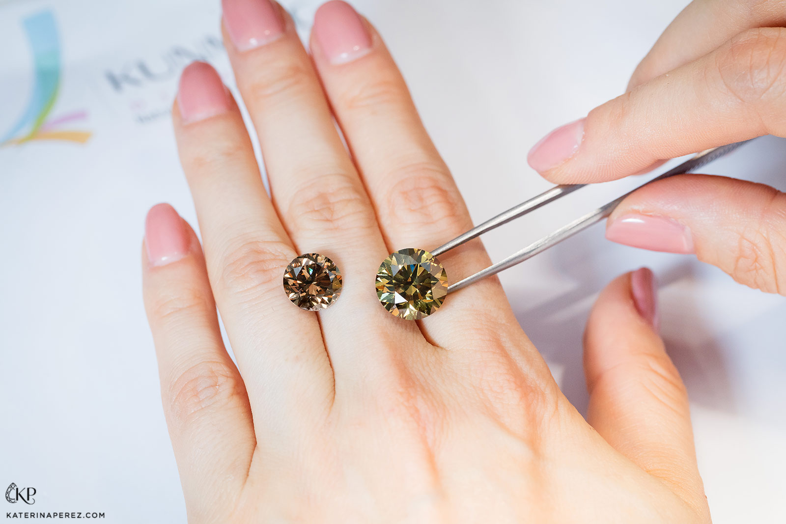 Kunming Diamonds 4.68 fancy brown diamond and 8.12cts fancy deep brown yellow round diamonds. Photo by Simon Martner