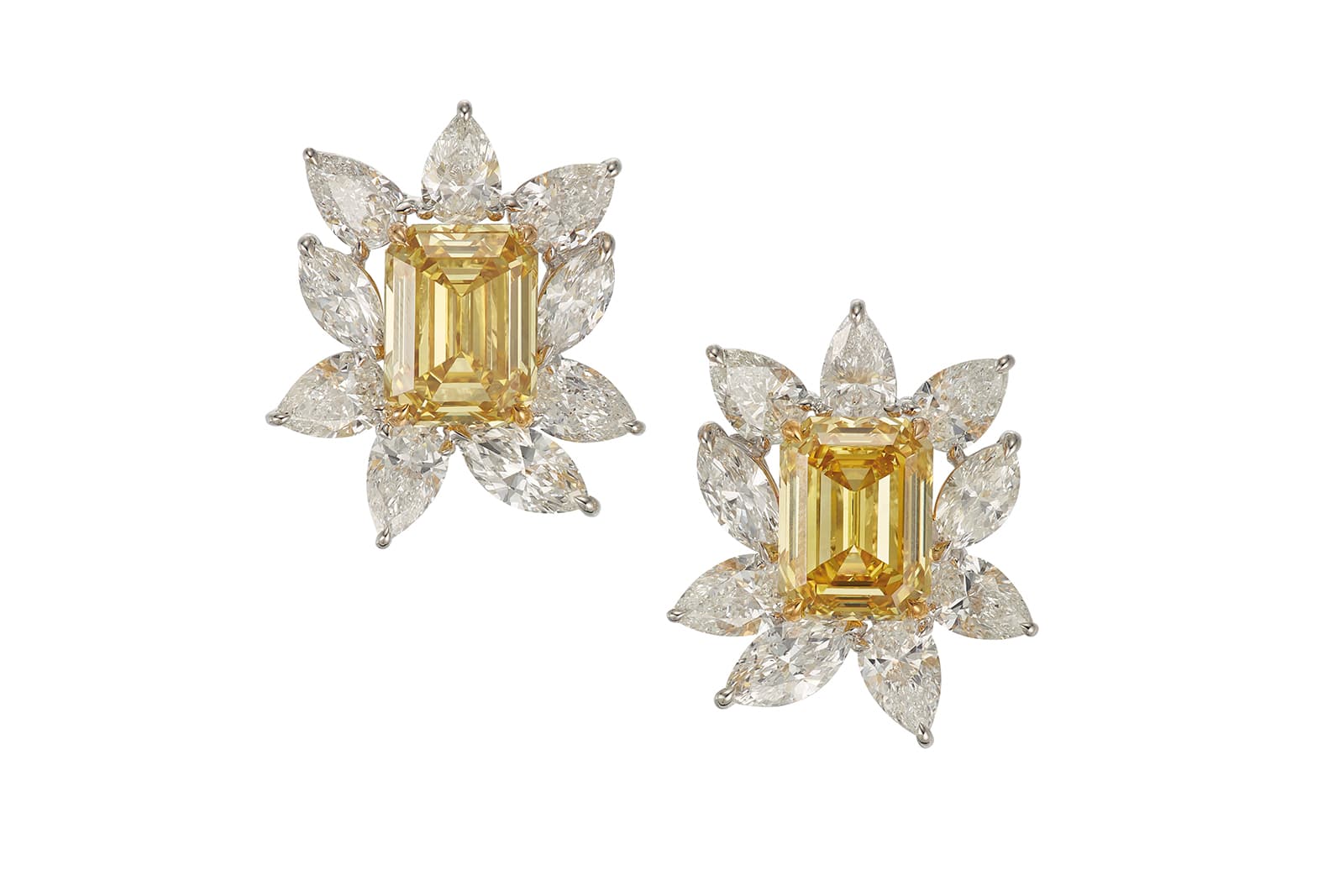 A pair of fancy deep yellow diamond earrings of 7.55 carats and 7.51 carats