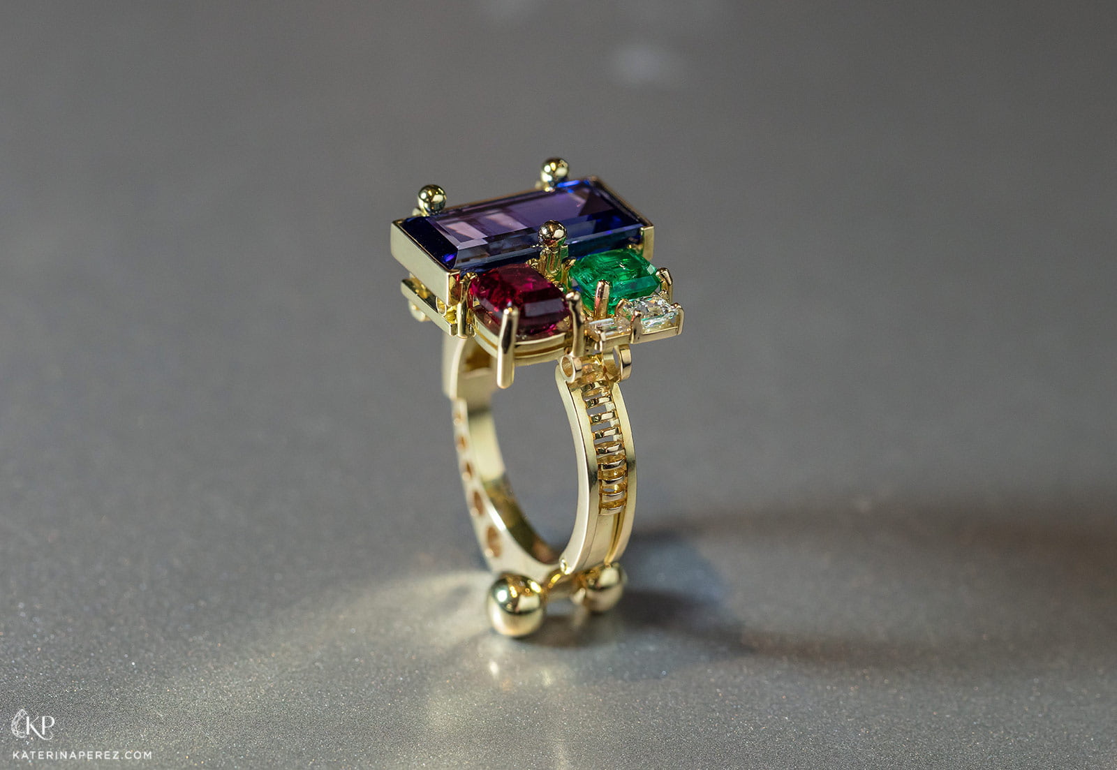 Milio Supremus ring with tanzanite, emerald, ruby and diamonds set in yellow gold