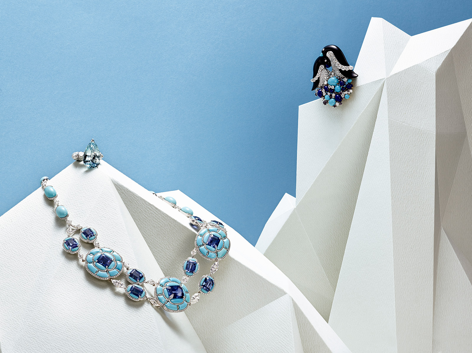 From left to right: Boghossian necklace with ceylon sapphires, turquoise and diamonds in white gold, Sarah Ho 'Pear Drop' ring with 16.30ct aquamarine, diamonds and white enamel on white gold, Van Cleef&Arpels 'Penguins' clip with turquoise, lapis lazuli, sapphires, onyx and diamonds in yellow and white gold