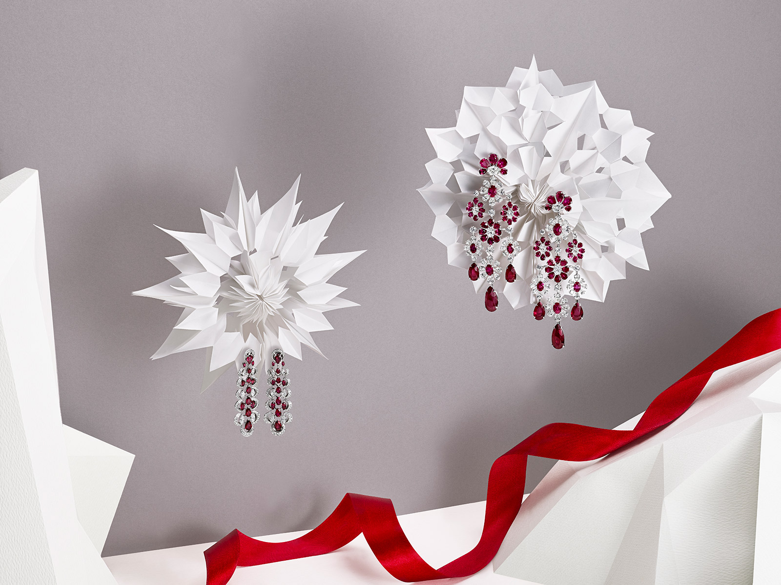 Left to right: Chopard Haute Joaillerie collection earrings with 6.75ct rubies and diamonds in white gold, and David Morris earrings with diamonds and rubies in white gold